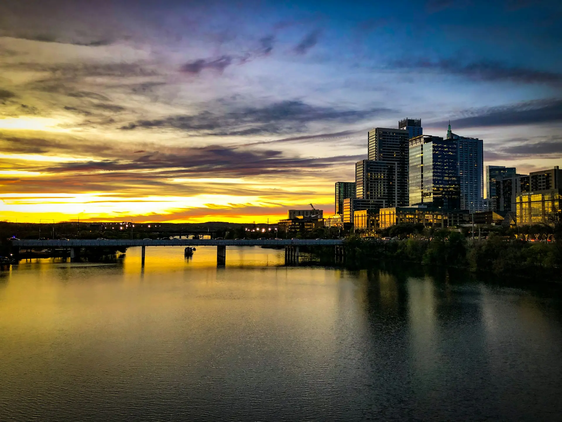 Downtown Austin skyline over Lady Bird Lake at sunset